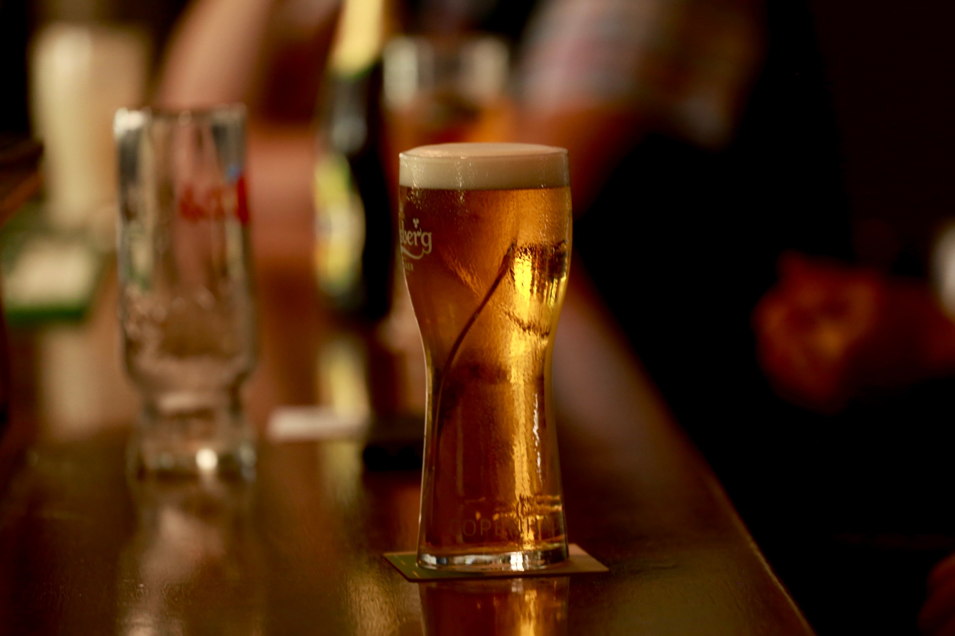 A cold Carlsberg pint on the bar